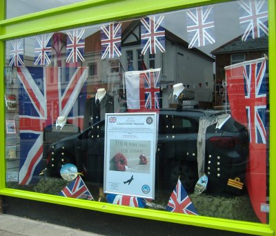 Lee High Street shop window of Navy Uniforms dressed for D-Day 70 Commemorations